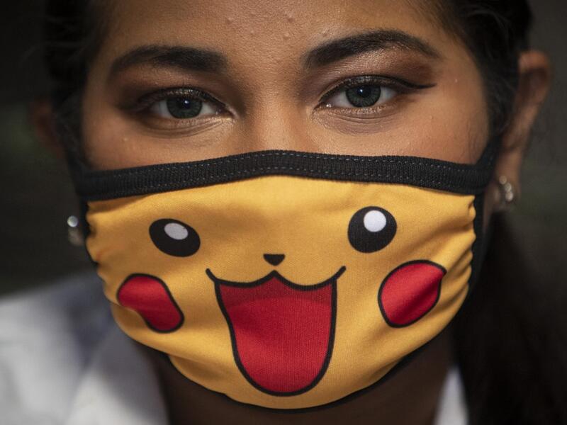 A doctor wears a face mask as a precautionary measure against the spread of the new coronavirus, COVID-19, as she waits for patients at a market in Managua, on March 18, 2020. The Nicaraguan government, which has not officially reported Covid-19 cases, continues to accept the arrival of tourists and massive activities, an attitude considered "irresponsible" by the opposition and health professionals. Inti OCON / AFP