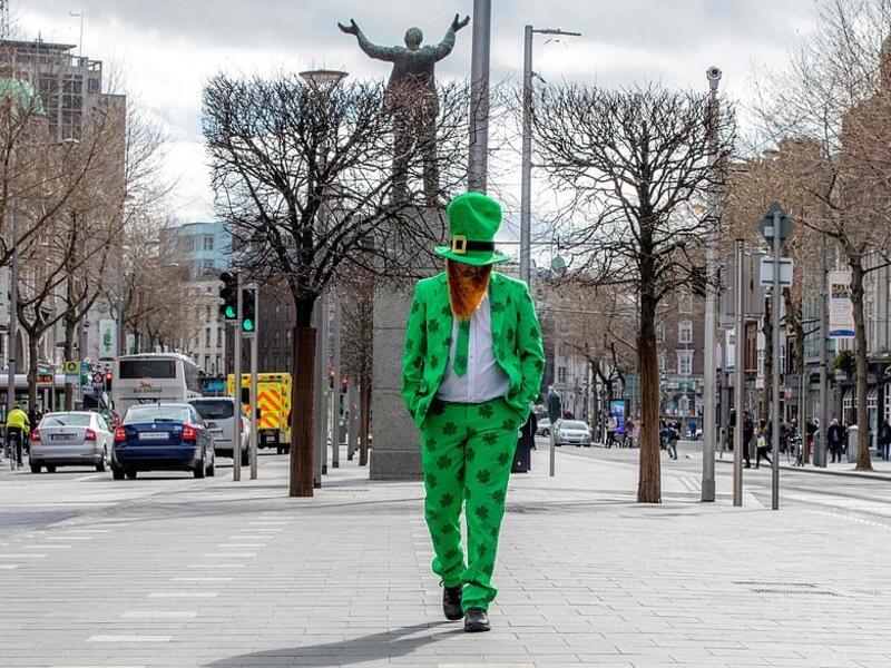 St Patrick's Day 2020 in Dublin: A man celebrating St Patrick's Day strolls in the O'Connell Street area of Dublin today as St Patrick's Day festivities are cancelled (AFP)