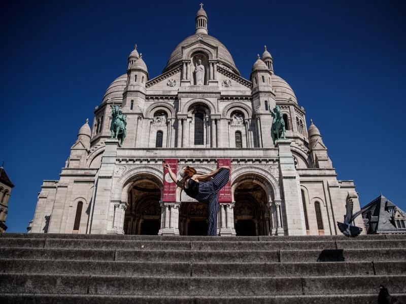 Syrian dancer and choreographer Yara al-Hasbani performs a dance on the empty Trocadero square in front of the Eiffel tower in Paris on April 22, 2020, on the 37th day of a strict lockdown in France to stop the spread of COVID-19 (novel coronavirus). Yara al-Hasbani was putting the finishing touches to her make-up for a performance of "Romeo and Juliet" in Damascus when she found out her father had been tortured to death. Sameer Al-DOUMY / AFP