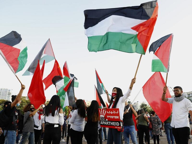 Protesters gather in Tel Aviv's Rabin Square on June 6, 2020, to denounce Israel's plan to annex parts of the occupied West Bank. Israeli Prime Minister Benjamin Netanyahu has vowed to forge ahead with annexing settlements and the Jordan Valley, in line with the peace proposals unveiled in January by US President Donald Trump. The plan has been angrily rejected by the Palestinians, who say they were not consulted on proposals they see as capitulating to Israeli demands. JACK GUEZ / AFP 