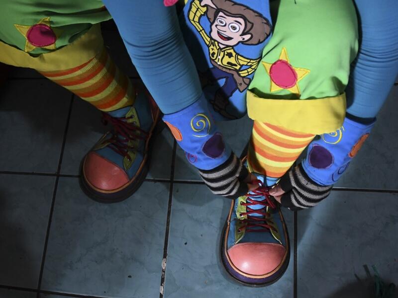 Mostacita.com clown prepares before taking to the streets to beg for money to survive the crisis caused by the new coronavirus in Villa Nueva, 20 km south Guatemala City, on June 10, 2020, as clowns have been unable to work due to restrictions to prevent the spread of the COVID-19. Johan ORDONEZ / AFP