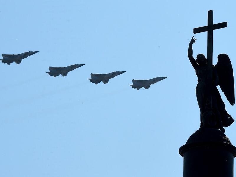 Russian military jets fly over Dvortsovaya Square during a military parade, which marks the 75th anniversary of the Soviet victory over Nazi Germany in World War Two, in Saint Petersburg on June 24, 2020. The parade, usually held on May 9, was postponed this year because of the coronavirus pandemic. OLGA MALTSEVA / AFP
