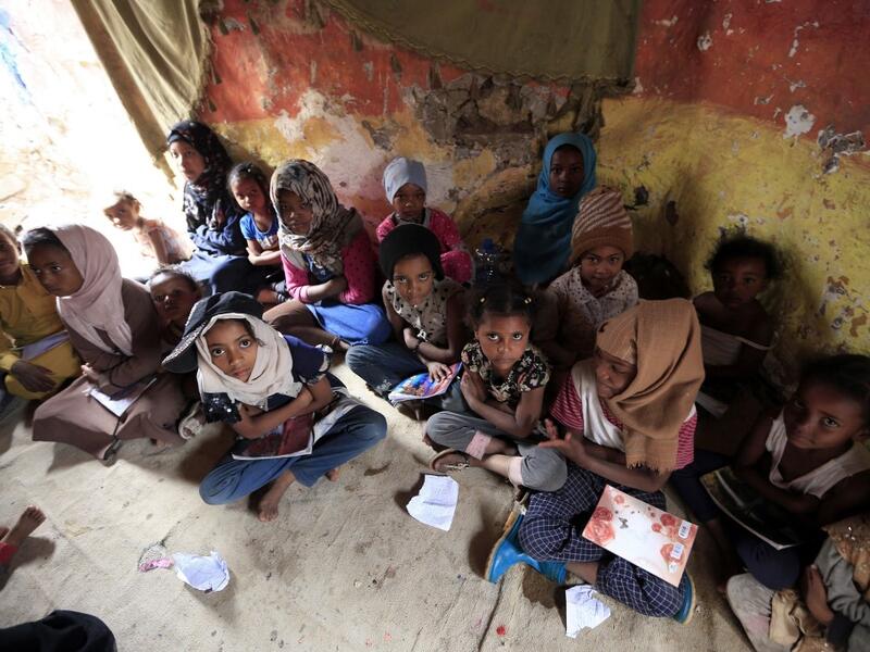 Children of Yemen's minority group known as "Muhamasheen" -- literally the "Marginalised" attend a lesson at a slum in the capital Sanaa on July 4, 2020. At a time when the Black Lives Matter movement is reshaping societies, black Yemenis have scant hope for an end to centuries of discrimination that has only worsened during the civil war. In Sanaa, members of the minority group known as "Muhamasheen" live in dismal conditions in densely populated slums. They count among the poorest of the poor in the Arab 