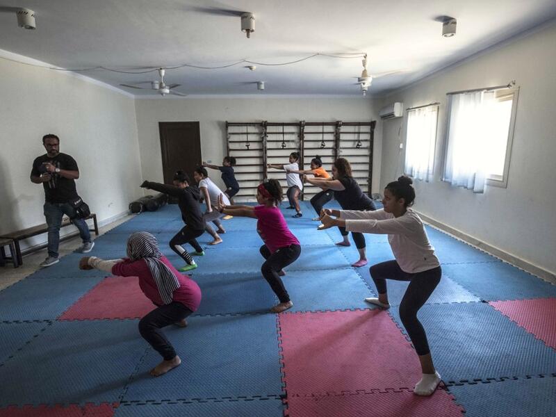 Youths from the "Children without Shelter" program attend a fitness sessions in their residences at Banati foundation in 6th October City on the outskirts of the capital Cairo on July 13, 2020.Khaled DESOUKI / AFP