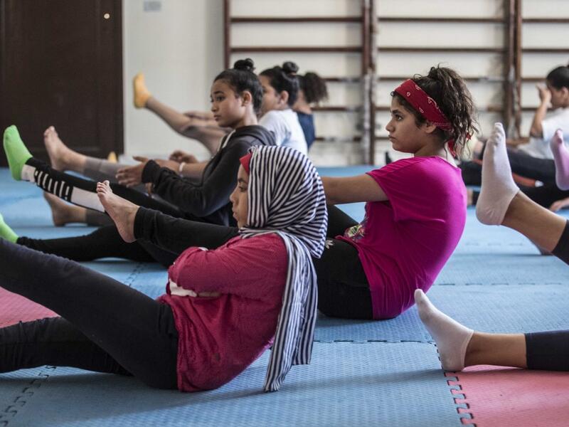 Youths from the "Children without Shelter" program attend a fitness sessions in their residences at Banati foundation in 6th October City on the outskirts of the capital Cairo on July 13, 2020. Khaled DESOUKI / AFP