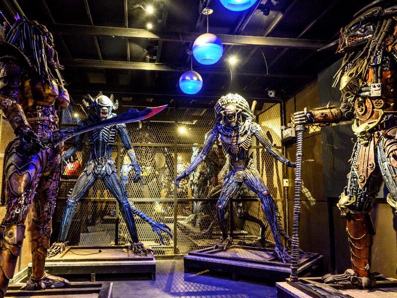 This photograph taken on July 18, 2020 shows life-sized sculptures of characters from the "Predator" film series made of scrap metal parts at the Ban Hun Lek museum in Ang Thong, some 100km north of Bangkok. "Ban Hun Lek" or "The House of Steel Robots" is a museum where a collective of artists display their scrap metal creations depicting popular comics and sci-fi film characters. Mladen ANTONOV / AFP