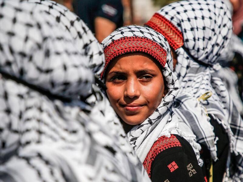 Palestinian children dressed in traditional dress attend a march marking Palestinian traditional customs day, in Gaza City. AFP