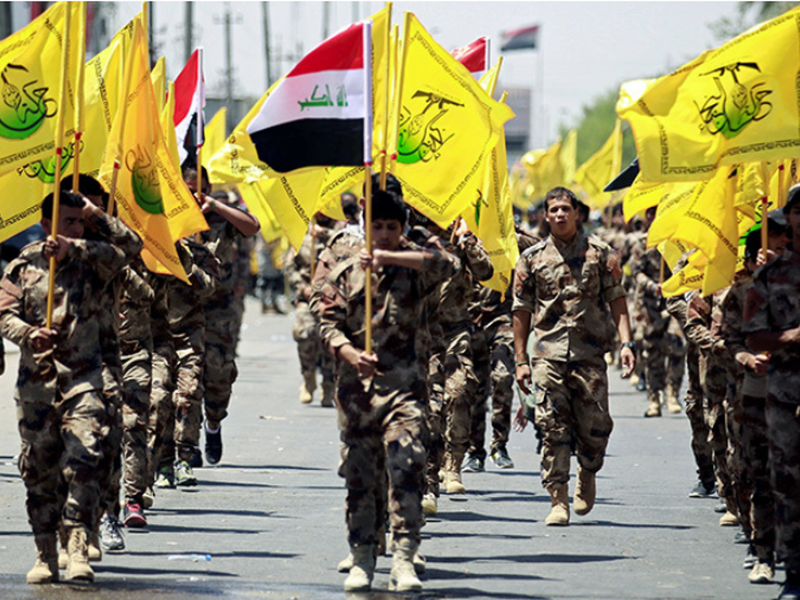 Iraqi Shiite Muslims from the Popular Mobilization Units march during a parade marking the annual Quds Day , Baghdad June 2017 /AFP