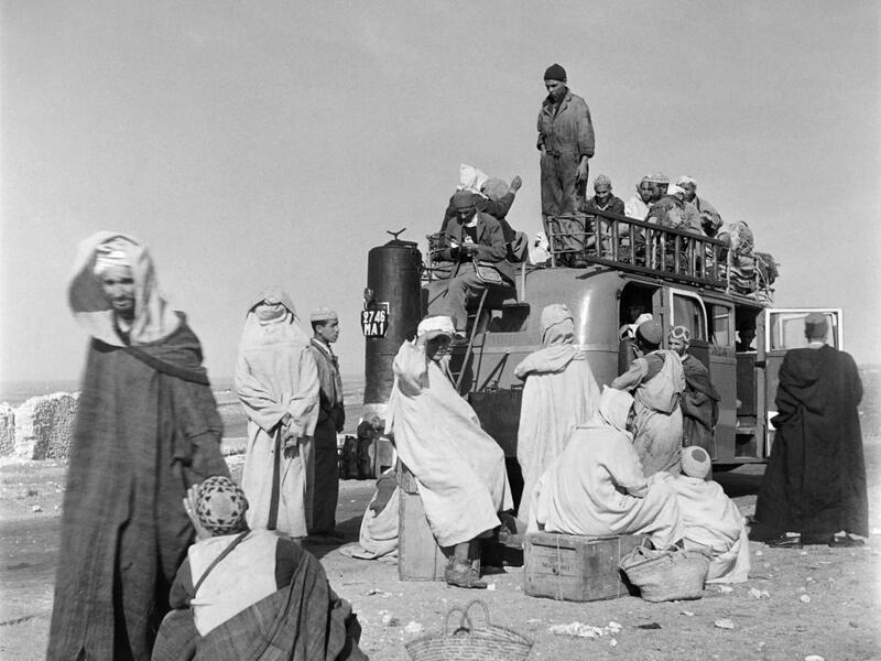 Men load their luggage onto a van, in November 1945 in Agadir, Morocco. AFP