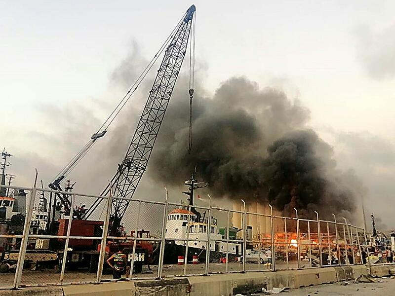 Lebanese media carried images of people trapped under rubble, some bloodied, after the massive explosions, the cause of which was not immediately known.  Layal ABOU RAHAL / AFP
