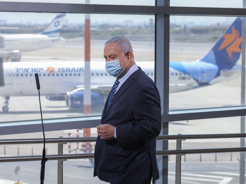 Israeli Prime Minister Benjamin Netanyahu arrives to make a speech during a visit to the Ben Gurion International Airport in Lod, on August 17, 2020. Emil Salman / POOL / AFP