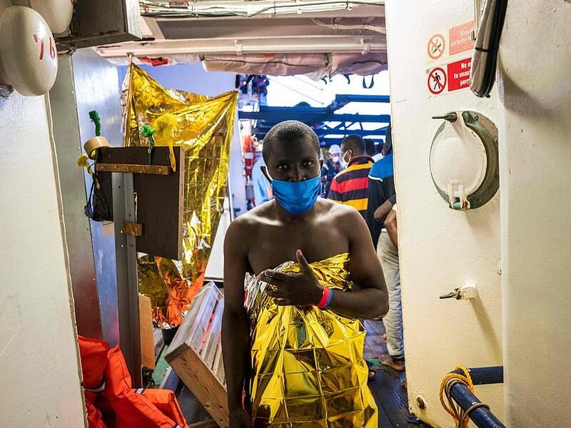'Solar blankets' are often used in emergency situations because they keep the body warm during cold weather and deflect heat during hot weather (AFP)