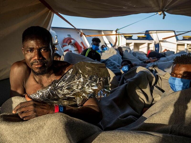 Appealing for help, Lea Reisner, head of operations for the Louise Michel, said: 'The people have sat in a mix of salt water and fuel for days' (AFP)