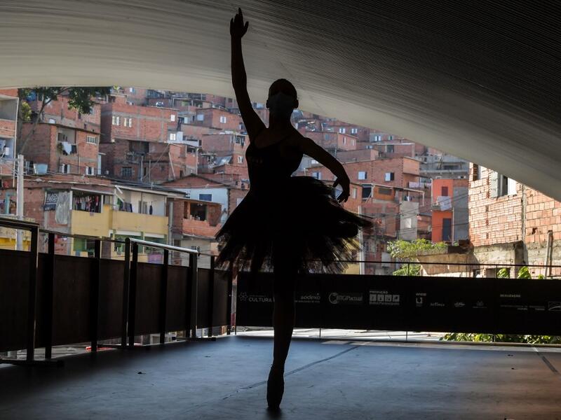 Kemilly Luanda, student of the Ballet Paraisopolis, poses during a rehearse in Paraisopolis favela, outskirts of Sao Paulo, Brazil on August 27, 2020, amid the new coronavirus COVID-19 pandemic. NELSON ALMEIDA / AFP