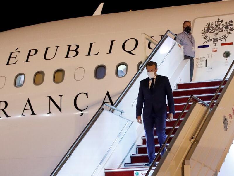 French President Emmanuel Macron arrives at Beirut International airport on August 31, 2020. Macron arrived in Beirut for his second visit since a deadly explosion on August 4 shook the nation and fuelled a drive for political change. Macron, who first flew to Beirut only two days after the blast, arrived at 9 pm (1800 GMT) for a two-day visit that will include a ceremony marking the centenary of Greater Lebanon. GONZALO FUENTES / POOL / AFP