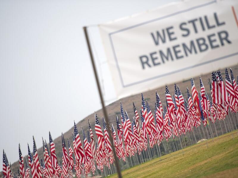 Some 3,000 flags comprise a 9/11 memorial at Pepperdine University in Malibu, California, on September 11, 2020, as the US commemorates the 19th anniversary of the attacks. Each flag represents a victim and their nationality. VALERIE MACON / AFP