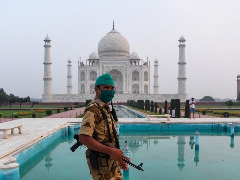 A security personnel patrols at the Taj Mahal in Agra on September 21, 2020. The Taj Mahal reopened to visitors on September 21 in a symbolic business-as-usual gesture even as India looks set to overtake the US as the global leader in coronavirus infections. Sajjad HUSSAIN / AFP