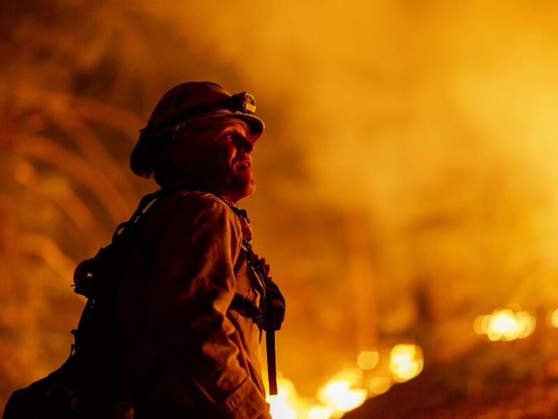Los Angeles County firefighters, using only hand tools, keep fire from jumping a fire break at the Bobcat Fire in the Angeles National Forest on September 11, 2020 north of Monrovia, California. California wildfires that have already incinerated a record 2.3 million acres this year and are expected to continue till December. The Bobcat Fire has grown to more than 26,000 acres. David McNew/Getty Images/AFP DAVID MCNEW / GETTY IMAGES NORTH AMERICA / Getty Images via AFP