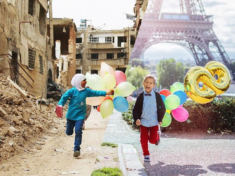 Syrian children run with balloons past heavily damaged buildings in the neighbourhood of Jobar, on the eastern outskirts of the Syrian capital Damascus on April 9, 2016. (ugurgallen/ Instagram)