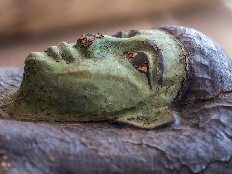 A picture taken on October 3, 2020 shows one of the sarcophaguses, excavated by the Egyptian archaeological mission which resulted in the discovery of a deep burial well with more than 59 human coffins closed for more than 2,500 years, displayed during a press conference at the Saqqara necropolis, 30 kms south of the Egyptian capital Cairo. They were unearthed south of Cairo in the sprawling burial ground of Saqqara, the necropolis of the ancient Egyptian capital of Memphis, a UNESCO World Heritage site. Th