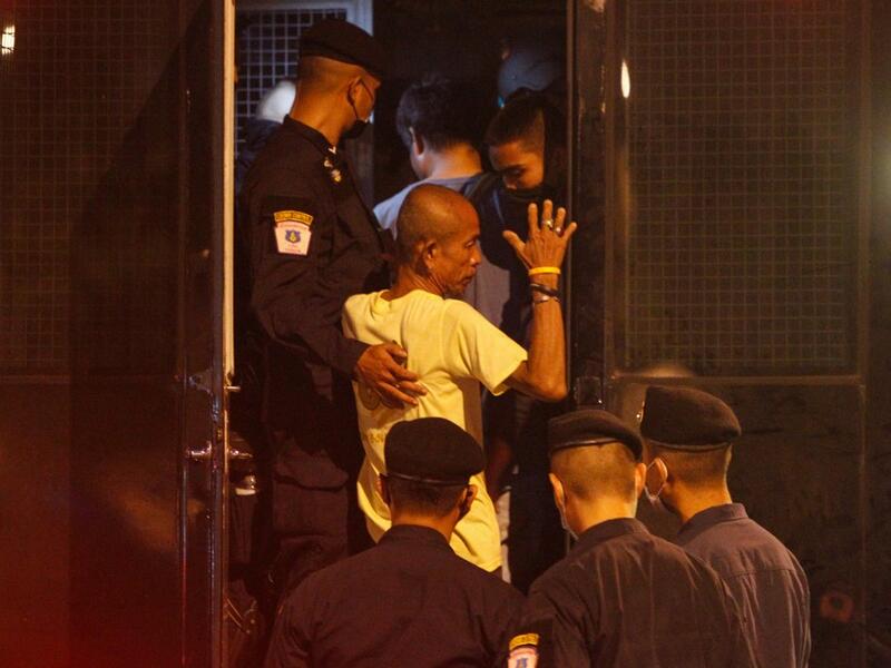 A pro-democracy protester is arrested by police in Bangkok on October 15, 2020, after the government declared a state of emergency following an anti-government rally the previous day. STR / AFP
