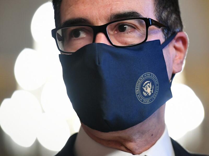 In this file photo US Treasury Secretary Steven Mnuchin speaks to reporters after briefing Senate Majority Leader Mitch McConnell, R-KY, on their meeting with House Speaker Nancy Pelosi, D-CA, and Senate Minority Leader Chuck Schumer, D-NY, for coronavirus relief talks at the US Capitol in Washington, DC on August 3, 2020. (AFP/File Photo)