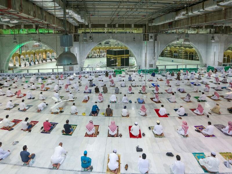 Saudi Arabia opened Islam's holiest site for prayers for the first time in seven months, and expanded the umrah pilgrimage to accommodate 15,000 worshippers as it relaxed coronavirus curbs. STR / AFP