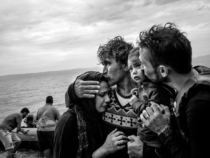 A Syrian family weeps tears of joy after reaching the Greek island of Lesbos from Turkey on a rubber boat, 10 October 2015.⁣ From ‘The Dream’ by Fabio Bucciarelli (@fabio_bucciarelli).⁣ (Instagram)
