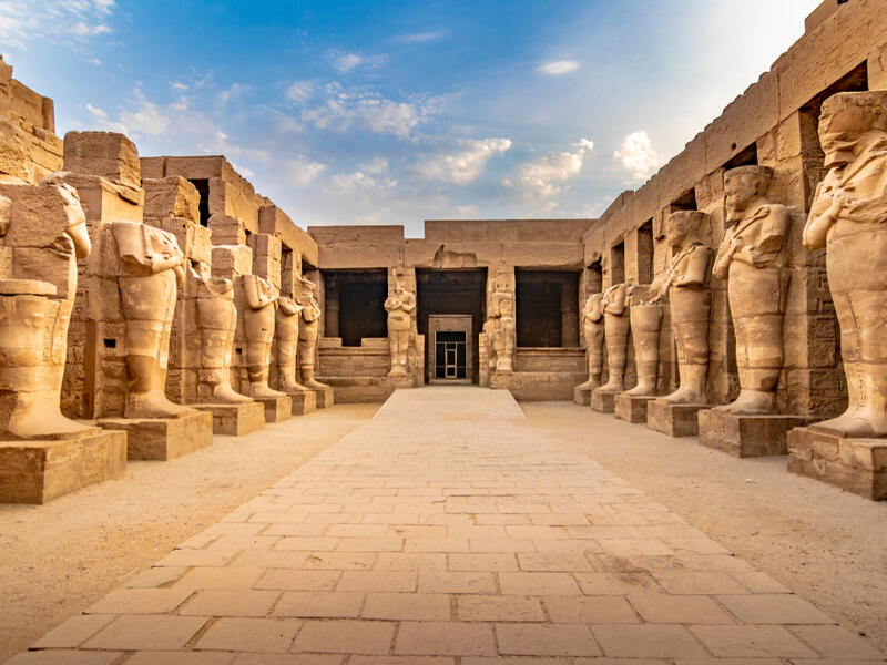Large sculptures of pharaohs inside beautiful Egyptian landmark with hieroglyphics, and ancient symbols.  (Shutterstock/ File Photo)