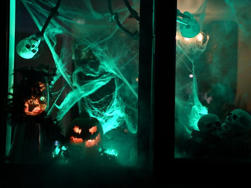 The window of a home is decorated for Halloween in east London on October 31, 2020. DANIEL LEAL-OLIVAS / AFP