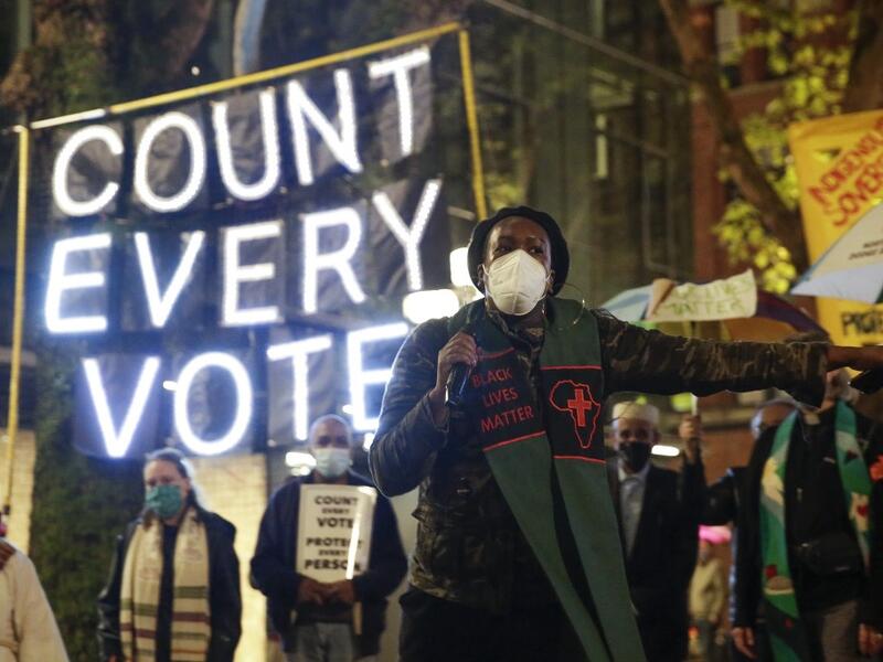 Reverend Bianca Davis-Lovelace of the Washington State Poor People's Campaign speaks at a rally and march to "Count Every Vote, Protect Every Person" a day after the US Presidential Election in Seattle, Washington on November 4, 2020. Democratic presidential challenger Joe Biden on November 4 neared the magic number of 270 electoral votes needed to win the White House with several battleground states still in play, as incumbent President Donald Trump challenged the vote count. Jason Redmond / AFP