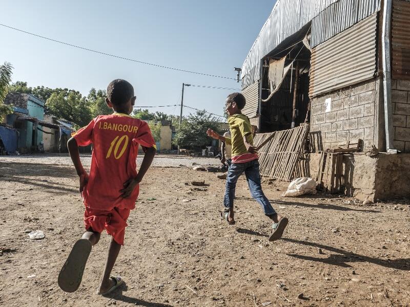 Children play next to the market in Humera, Ethiopia, on November 22, 2020. Prime Minister Abiy Ahmed, last year's Nobel Peace Prize winner, announced military operations in Tigray on November 4, 2020, saying they came in response to attacks on federal army camps by the party, the Tigray People's Liberation Front (TPLF). EDUARDO SOTERAS / AFP
