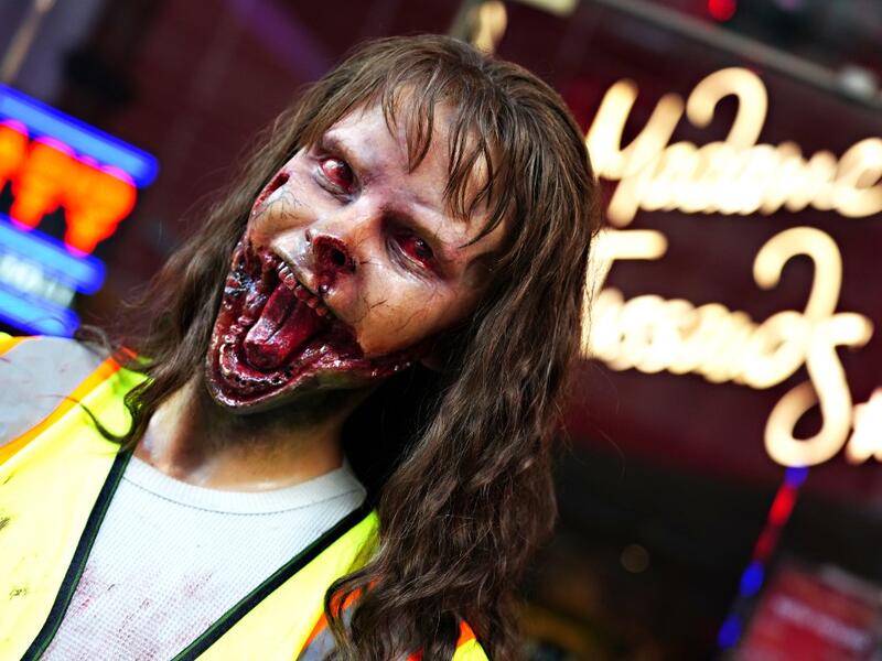 A zombie figure is displayed outside of Madame Tussauds for Halloween on October 31, 2020 in New York City. Many Halloween events have been canceled or adjusted with additional safety measures due to the ongoing coronavirus (COVID-19) pandemic. Cindy Ord/Getty Images/AFP