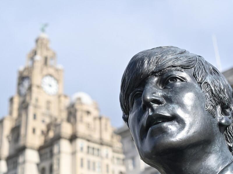 In this file photo taken on October 07, 2020 a statue of John Lennon and members of the Beatles stands in central Liverpool, northwest England on October 7, 2020. John Lennon's career was cut short 40 years ago, on December 8, 1980, when he was shot dead in New York. Paul ELLIS / AFP
