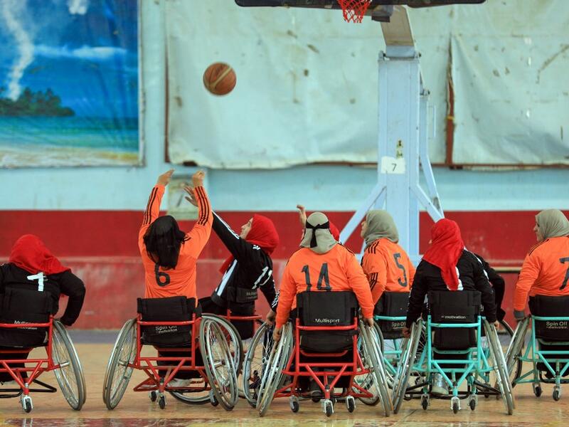 Disabled Yemeni women take part in a local wheelchair basketball championship in Yemen's capital Sanaa on December 8, 2020. In conflict-ridden Yemen, nine teams, including five-all women groups, competed in a local championship for the disabled in the capital Sanaa, which has been under rebel control since 2014. The players are competing to be embraced by society for their strengths rather than be viewed as a burden during the time of war. Mohammed HUWAIS / AFP