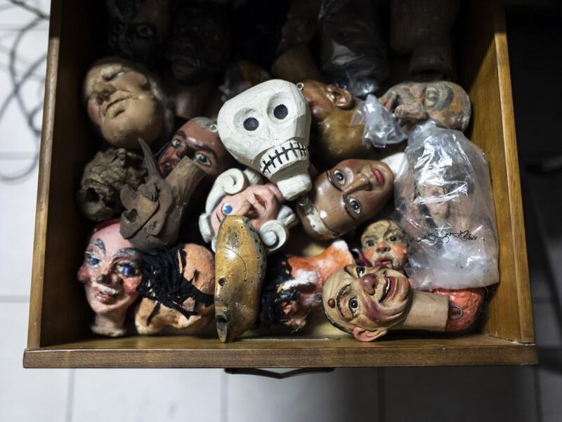 Puppet heads lies in a drawer at the " Alfa Theatre" laboratory in Turin, on November 30, 2020. The Grilli family has a collection of more than 20,000 objects from around the world, everything from theatres, marionettes and glove puppets to shadow figures and silhouettes. A long-time dream of Grilli and his wife Mariarosa, 78, the museum is due to open in 2023 in Turin, financed both privately and publicly with the help of different institutions.  Marco Bertorello / AFP