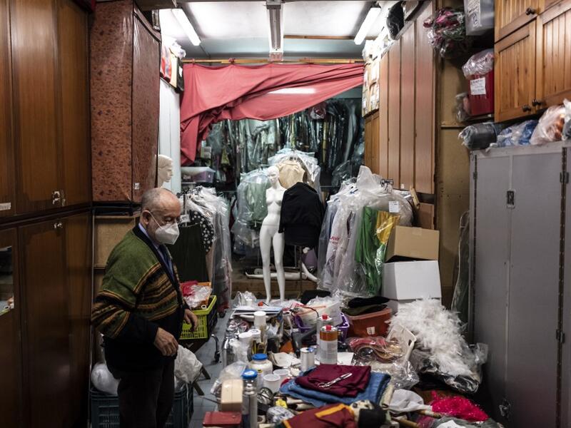Augusto Grilli works in his " Alfa Theatre" laboratory in Turin, on November 30, 2020. The Grilli family has a collection of more than 20,000 objects from around the world, everything from theatres, marionettes and glove puppets to shadow figures and silhouettes. A long-time dream of Grilli and his wife Mariarosa, 78, the museum is due to open in 2023 in Turin, financed both privately and publicly with the help of different institutions.  Marco Bertorello / AFP