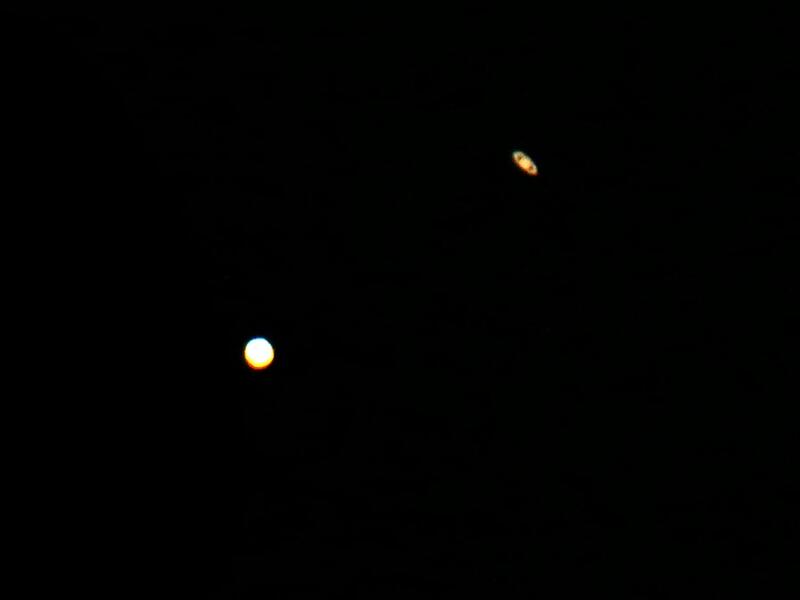 A picture taken on December 21, 2020, in al-Salmi district, a desert area 120 kms west of Kuwait City, shows the great conjunction of Jupiter and Saturn. The great conjunction refers to the alignment of Jupiter and Saturn. YASSER AL-ZAYYAT / AFP
