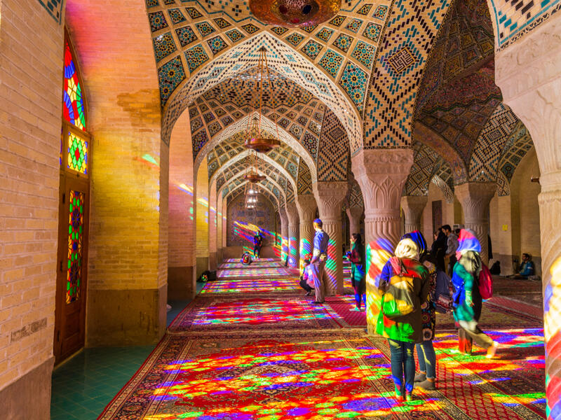 Lot of tourists taking photos in the interior of Nasir Al-Mulk Mosque (Pink Mosque) with colorful shining stained glass windows. (Shutterstock/ File Photo)