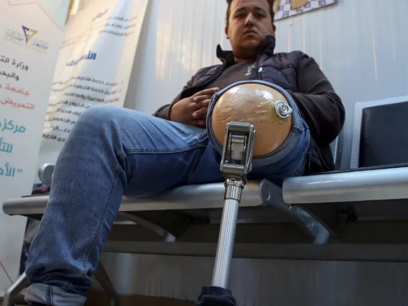 A patient waits for a consultation at the National Center for Artificial Limbs, in Libya's port city of Misrata, on December 17, 2020. With Libya's health sector left in tatters by its multiple conflicts since the 2011 revolution, war-wounded Libyans are often sent abroad for treatment, at the expense of the state. However, A national centre for prostheses, being established in Misrata, already has a patient waiting list of more than 3,000 amputees