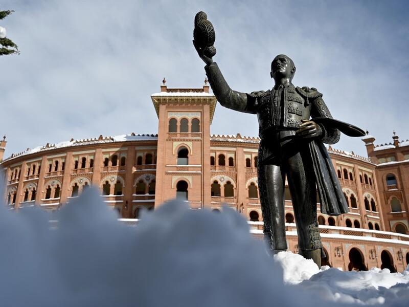 Snow covers the area outside the Las Ventas bullring in Madrid on January 10, 2021. Snowstorms in Spain left three people dead and caused chaos across much of the country, trapping motorists and shutting down the capital's air and rail links. Gabriel BOUYS / AFP