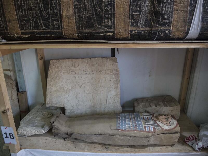 A sarcophagus is displayed during the official announcement of the discovery by an Egyptian archaeological mission of a new trove of treasures at Egypt's Saqqara necropolis south of Cairo, on January 17, 2021. The discovery at the necropolis which lies 30kms south of the Egyptian capital, includes the funerary temple of Queen Naert, wife of King Teti, as well as burial shafts, coffins, and mummies dating back to nearly 3000 years ago during the New Kingdom. Khaled DESOUKI / AFP