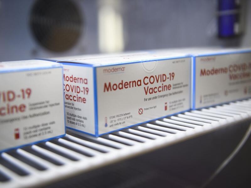 Boxes containing vials of the Moderna Covid-19 vaccine are stored at the Kedren Community Health Center on January 25, 2021 in Los Angeles, California. While vaccination priority is given to people including healthcare workers and the elderly, some outside the priority tiers are waiting in line to potentially receive a dose that needs to be administered before it expires and goes to waste. Patrick T. FALLON / AFP