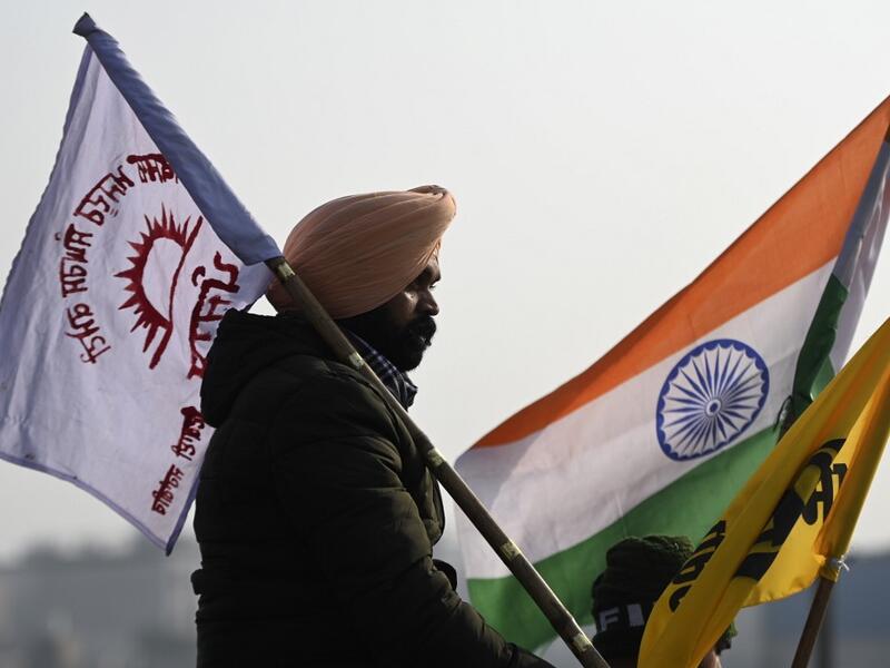 A farmer takes part in a tractor rally as they continue to demonstrate against the central government's recent agricultural reforms in New Delhi on January 26, 2021. Money SHARMA / AFP