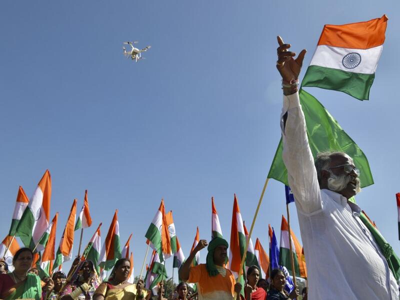 Activists and farmers take part in a protest as they continue to demonstrate against the central government's recent agricultural reforms, in Bangalore on January 26, 2021. Manjunath Kiran / AFP