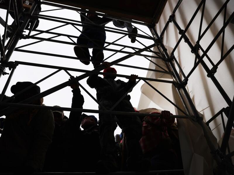 Trump supporters had gathered in the nation's capital to protest the ratification of President-elect Joe Biden's Electoral College victory over President Trump in the 2020 election. Spencer Platt/Getty Images/AFP