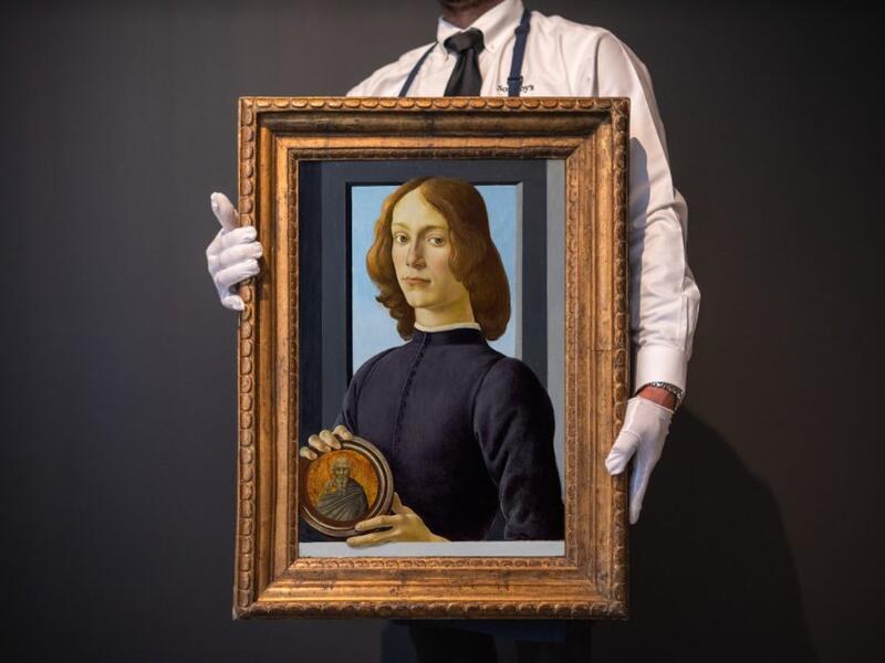 لوحة young man holding a roundel 