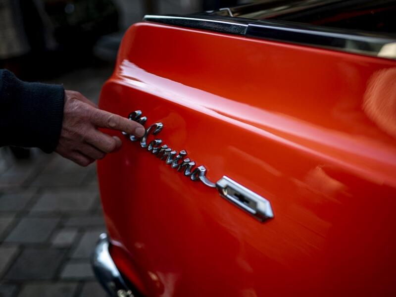 This picture taken on January 16, 2021 shows the side emblem of a 1964 El Camino Chevrolet during a gathering of auto enthusiasts in Tokyo. A loose club of fans rolls up most weekends in central Tokyo to show off their Cadillacs, Chevrolets and other modern classic vehicles from the mid to late 20th century. Philip FONG / AFP
