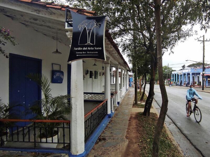 A man passes by a closed handicraft shop in Vinales, Cuba, on January 28, 2021. At the foot of the majestic rock formations of Vinales, the terraces of the restaurants look empty and the lodgings have closed. With the arrival of COVID-19, the incipient prosperity of this Cuban town came to a halt and people abandoned tourism jobs to return to work the land. YAMIL LAGE / AFP