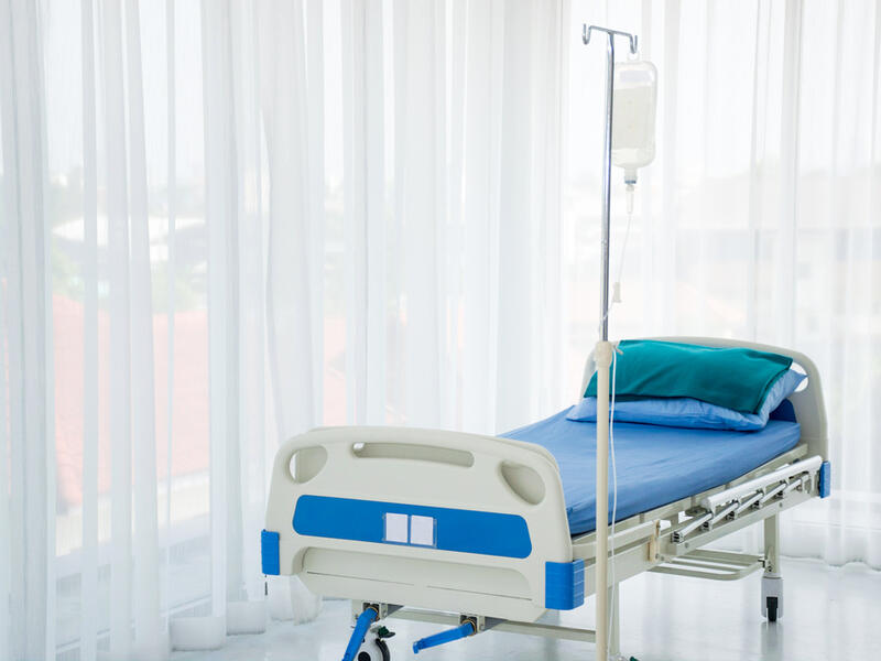 An empty hospital bed 